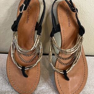 Zigisoho cute sandals with gold straps and chains. Heel strap and buckle.